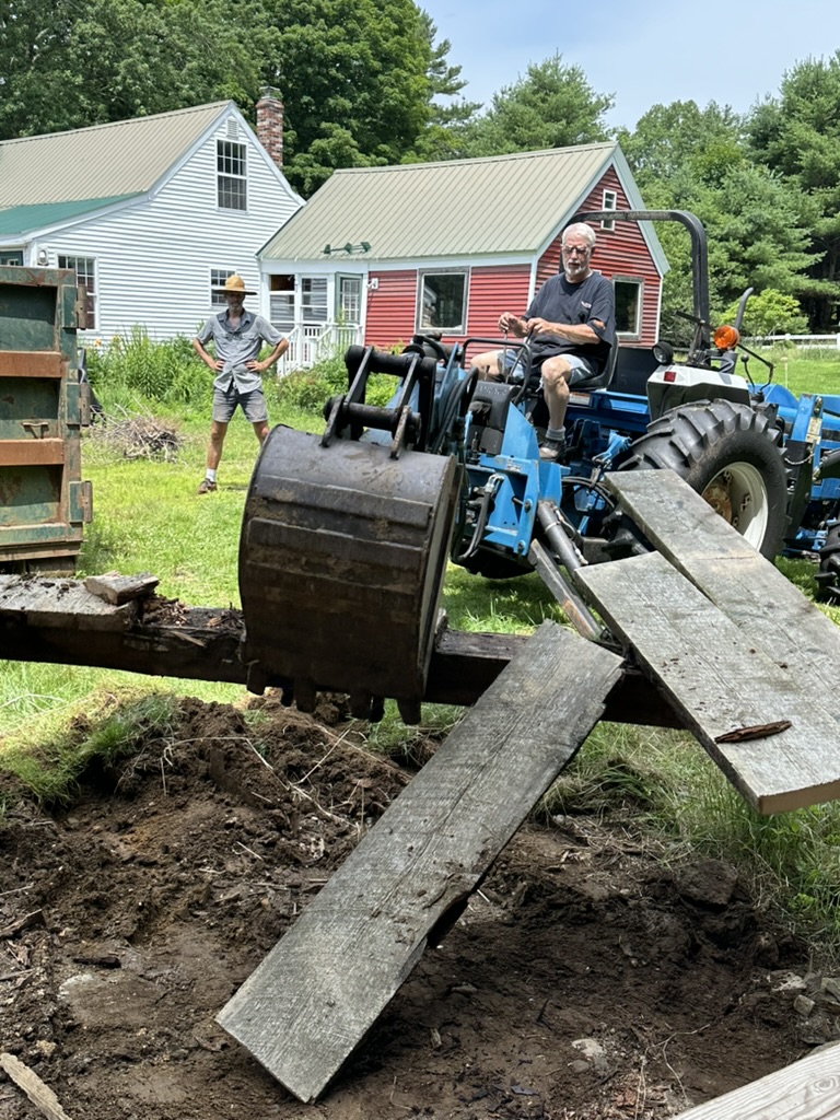 Dick Bragg on his tractor helping with land work at South Road Farm